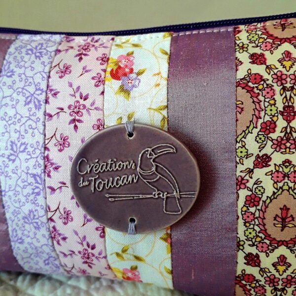 Pochette toucan prune