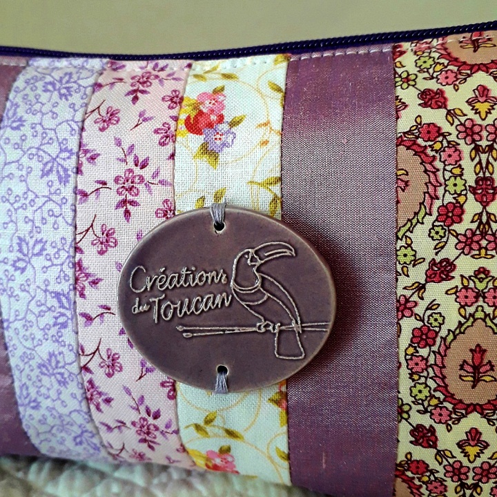 Pochette toucan prune